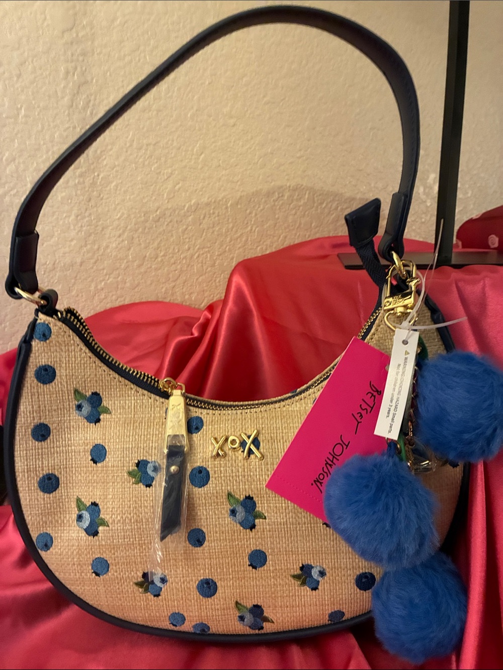 Betsey Johnson Straw Shoulder Bag with Blue Floral Embroidery and Blue Pom Poms